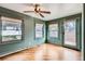Bedroom with hardwood floors, natural light, and a view to the backyard at 1006 S Emerson St, Denver, CO 80209