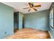 Spacious bedroom features hardwood floors and a stylish ceiling fan at 1006 S Emerson St, Denver, CO 80209