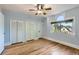 Bright bedroom features hardwood floors, ample closet space and natural light at 1006 S Emerson St, Denver, CO 80209