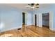 Bedroom features hardwood floors and built-in closets at 1006 S Emerson St, Denver, CO 80209