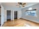 Bright bedroom with hardwood floors, natural light, and closets at 1006 S Emerson St, Denver, CO 80209