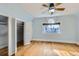 Bright bedroom with hardwood floors, natural light, and closet at 1006 S Emerson St, Denver, CO 80209