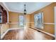 Bright dining area featuring hardwood floors, ample natural light, and designer pendant lighting at 1006 S Emerson St, Denver, CO 80209