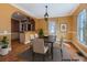 Charming dining area with pendant lighting and open access to the kitchen at 1006 S Emerson St, Denver, CO 80209