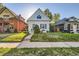 Charming home with well-manicured lawn and attractive curb appeal at 1006 S Emerson St, Denver, CO 80209