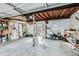 Spacious, unfinished garage area with a concrete floor, work area and tools at 1006 S Emerson St, Denver, CO 80209