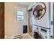 Compact laundry area with stacked washer/dryer, window, and functional design at 1006 S Emerson St, Denver, CO 80209
