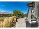 Backyard patio with outdoor furniture, stone retaining wall, and stairs to the upper level at 10731 Featherwalk Ln, Highlands Ranch, CO 80126