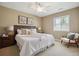 Bedroom with a neutral color palette, large window and soft textures at 10731 Featherwalk Ln, Highlands Ranch, CO 80126