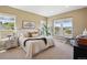 Bedroom with multiple windows and neutral decor at 10731 Featherwalk Ln, Highlands Ranch, CO 80126