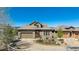 Charming stone home with well-manicured front yard and a curved driveway at 10731 Featherwalk Ln, Highlands Ranch, CO 80126