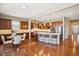 Spacious kitchen with stainless steel appliances, island with bar seating, and a breakfast nook area at 10731 Featherwalk Ln, Highlands Ranch, CO 80126