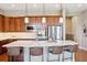 Beautiful kitchen featuring a large island with bar seating, pendant lighting, and stainless steel appliances at 10731 Featherwalk Ln, Highlands Ranch, CO 80126
