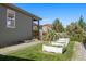 Backyard featuring raised garden beds and greenery against the backdrop of a home's exterior at 12210 Pine Post Dr, Parker, CO 80138