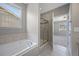 Bathroom featuring a tub and shower combination, offering a relaxing and functional space at 12210 Pine Post Dr, Parker, CO 80138