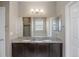 Bathroom featuring a double sink vanity with a granite countertop and a large mirror at 12210 Pine Post Dr, Parker, CO 80138