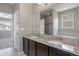 The bathroom features a double vanity, a large mirror, and a tub and shower combination at 12210 Pine Post Dr, Parker, CO 80138