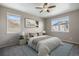 Bright bedroom with a queen bed, modern art, and plenty of natural light at 12210 Pine Post Dr, Parker, CO 80138