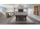Bonus room featuring a pool table, seating, and a custom cue rack for entertaining guests at 12210 Pine Post Dr, Parker, CO 80138