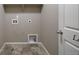 Laundry room featuring tile floor, neutral walls, and essential hookups at 12210 Pine Post Dr, Parker, CO 80138