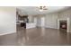 Spacious living room with a cozy fireplace, and dark hardwood flooring at 12210 Pine Post Dr, Parker, CO 80138