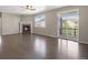 Spacious living room with a cozy fireplace, and access to the patio at 12210 Pine Post Dr, Parker, CO 80138