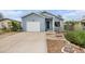 Charming home featuring a well-maintained lawn, a driveway, and a one-car garage at 309 Lincoln Ave, Platteville, CO 80651