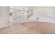 Spacious living room featuring neutral carpet, archways, and ample natural light at 309 Lincoln Ave, Platteville, CO 80651