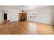 Hardwood floors, wood burning stove and large windows create a warm, inviting living space at 309 Lincoln Ave, Platteville, CO 80651