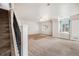 Upstairs loft space, carpeted with a ceiling fan and nice light at 309 Lincoln Ave, Platteville, CO 80651