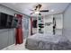 Comfortable bedroom with a ceiling fan, large closet, and window with natural light at 1204 S Uvalda St, Aurora, CO 80012