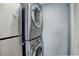 Laundry room features stacked washer/dryer and is conveniently located near the kitchen at 1204 S Uvalda St, Aurora, CO 80012