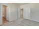 Spacious carpeted bedroom featuring three doors, one to the bathroom at 1580 E 3Rd Ave, Longmont, CO 80501