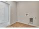 Clean, well-lit laundry room with wood-look floors and connections for a washer and dryer at 1580 E 3Rd Ave, Longmont, CO 80501