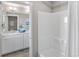 Well-lit bathroom features a tub/shower combo and a large vanity at 4338 Cattle Cross Trl, Castle Rock, CO 80104