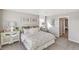 Bedroom featuring a bed with a white pattern, a dresser, art, and carpeted floors at 4338 Cattle Cross Trl, Castle Rock, CO 80104