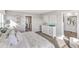 Bedroom featuring a bed with a white pattern, a dresser, art, and carpeted floors at 4338 Cattle Cross Trl, Castle Rock, CO 80104