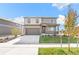 Charming two-story home with a covered porch, two car garage and lovely landscaping at 4338 Cattle Cross Trl, Castle Rock, CO 80104