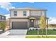 Two story home featuring a 2-car garage, a covered porch and a well-maintained lawn at 4338 Cattle Cross Trl, Castle Rock, CO 80104