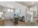 Bright home office featuring hardwood floors, a large desk, and comfortable guest seating at 4338 Cattle Cross Trl, Castle Rock, CO 80104