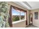 Bright bedroom with a view and a decorative mirror at 22268 E Hidden Trail Dr, Parker, CO 80138