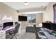 Modern bedroom with a large window, television, desk and gaming setup, and comfortable bed at 22268 E Hidden Trail Dr, Parker, CO 80138