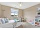 Bedroom with bright window, a cozy bed, and a charming desk and bookcase providing style and functionality at 22268 E Hidden Trail Dr, Parker, CO 80138