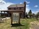 Exterior of a charming coffee house with a welcoming sign, stone accents, and outdoor seating area at 22268 E Hidden Trail Dr, Parker, CO 80138