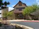 Exterior of a commercial building with stone accents, a walkway, and well-maintained landscaping at 22268 E Hidden Trail Dr, Parker, CO 80138