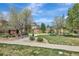 Community playground featuring play equipment, a picnic bench, and a grassy area for outdoor activities at 22268 E Hidden Trail Dr, Parker, CO 80138