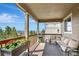 Outdoor deck with comfortable seating, wooden railings, and a beautiful view at 22268 E Hidden Trail Dr, Parker, CO 80138