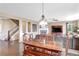 Open-concept dining room with hardwood floors adjacent to living room and staircase at 22268 E Hidden Trail Dr, Parker, CO 80138