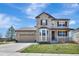 Charming two-story home with stone and tan siding, landscaped yard, and inviting front porch at 22268 E Hidden Trail Dr, Parker, CO 80138