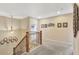 Upstairs hallway with a staircase, carpet and lovely decor at 22268 E Hidden Trail Dr, Parker, CO 80138